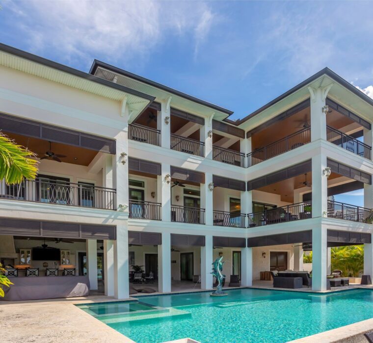 3 story residential backyard with a pool