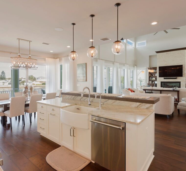 white marble kitchen overlooking living room